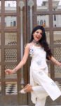White Sleeveless Mirror Work Kurta Set with Floral Embroidery