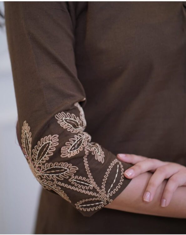Woman wearing a brown embroidered kurti and pant co-ord set, perfect for daily wear, office wear, and ethnic occasions.