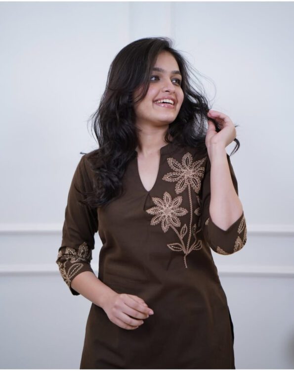 Woman wearing a brown embroidered kurti and pant co-ord set, perfect for daily wear, office wear, and ethnic occasions.
