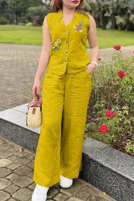 Woman wearing a mustard yellow sleeveless embroidered cotton co-ord set with wide-leg pants in a garden setting.