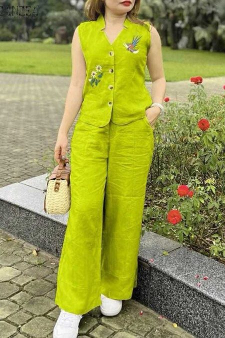Woman wearing a lime green embroidered sleeveless cotton co-ord set with palazzo pants in a garden.