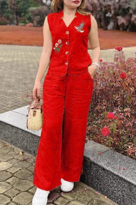 Woman wearing a bright red embroidered sleeveless cotton kurti co-ord set with matching palazzo pants in a garden setting.