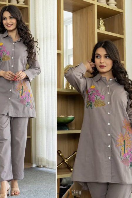 Model wearing taupe embroidered cotton co-ord set featuring floral button-down shirt and matching straight pants, ideal for office or casual wear.