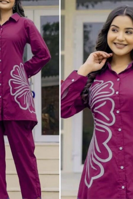 Model wearing magenta cotton co-ord set for women featuring floral print button-down shirt and straight pants, perfect for work or casual outings.